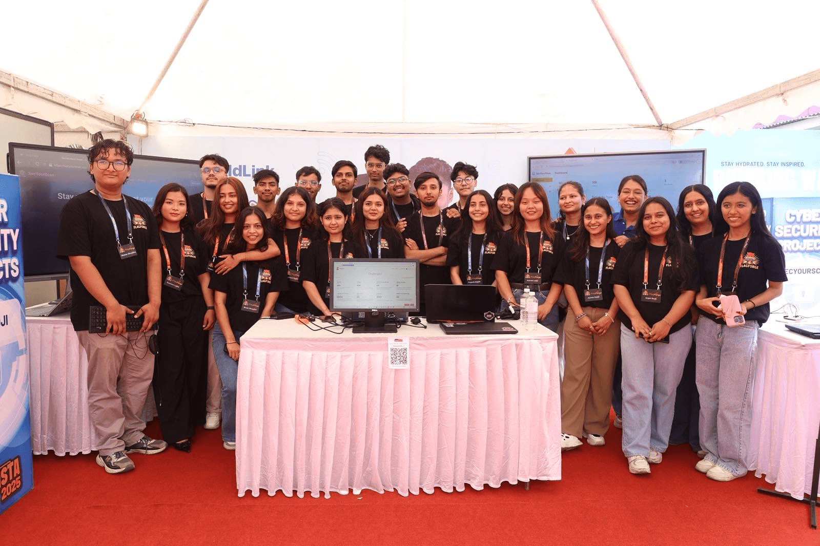 Team photo of the FlagForge builders at their booth.